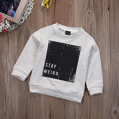 Stay weird sweater